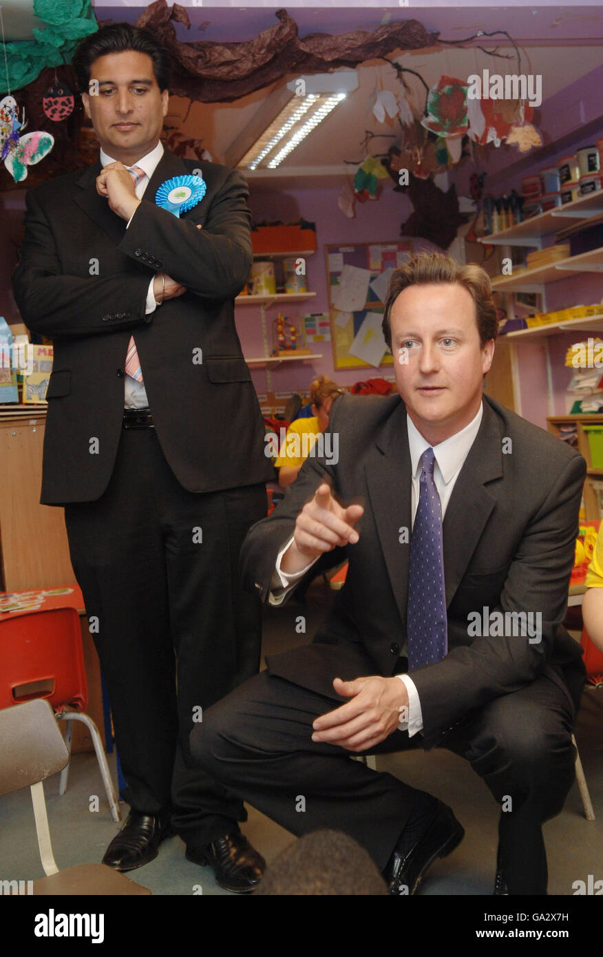 Conservative Party leader David Cameron campaigns for the council by-election at a childrens play group at the YMCA in Ealing, west London today with Tory candidate Tony Lit (left). Stock Photo