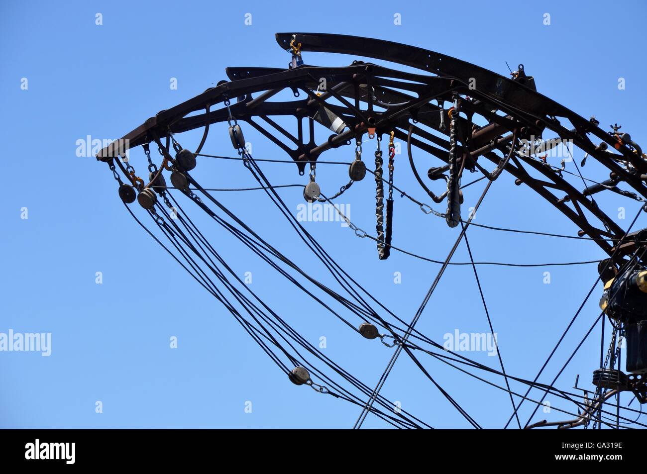 Closeup detail of an industrial winch system with cables and pulleys