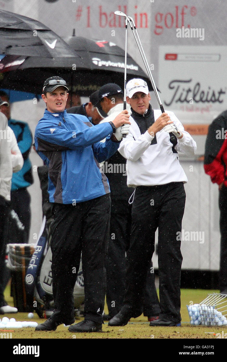 England's Ian Poulter (right) and Justin Rose on the driving range during the practice day of The 136th Open Championship at Carnoustie, Scotland. Stock Photo