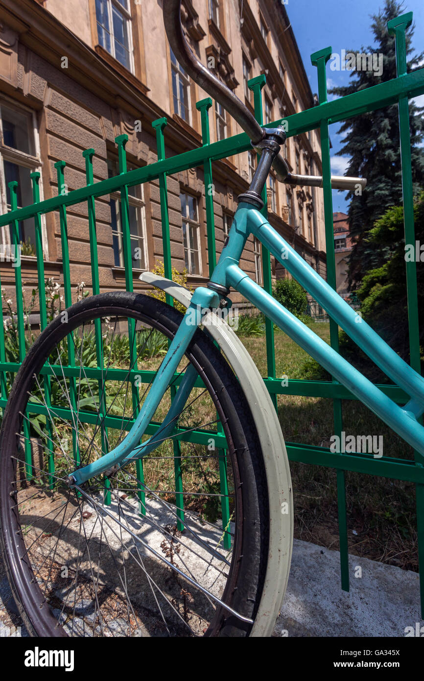 older bike leaning against the iron fence, Olomouc, South Moravia, Czech Republic Stock Photo