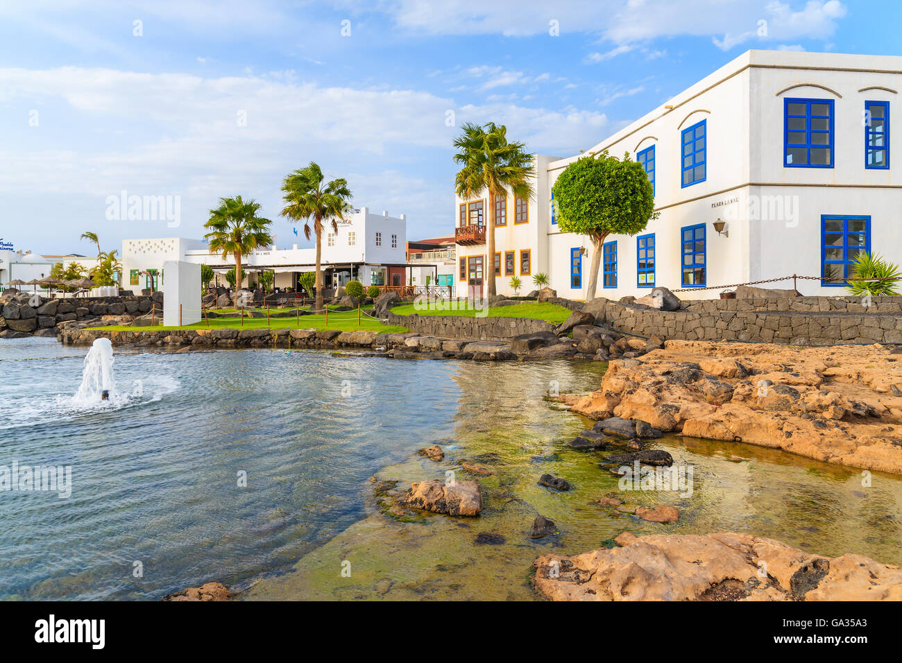 MARINA RUBICON, LANZAROTE ISLAND - JAN 11, 2015: typical Canarian houses in Rubicon port. Canary Islands are popular tourist destination due to sunny tropical climate all year round. Stock Photo