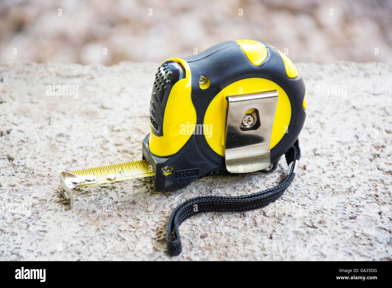 Tape measure tool on brick with background rock nature.Background