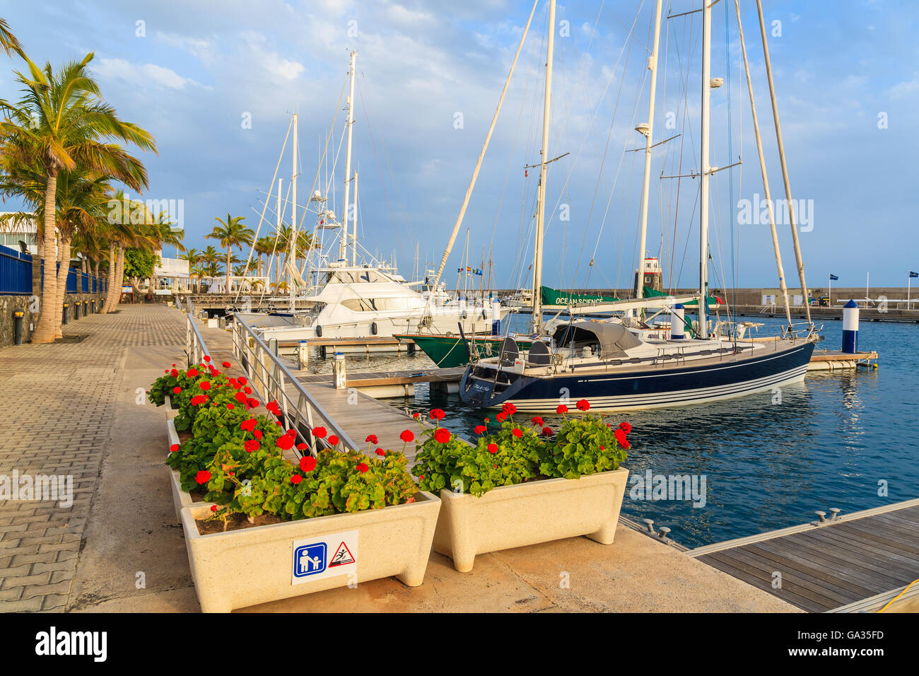 PUERTO CALERO MARINA, LANZAROTE ISLAND - JAN 17, 2015: luxury boats in port built in Caribbean style in Puerto Calero. Canary Islands are popular sailing destination. Stock Photo