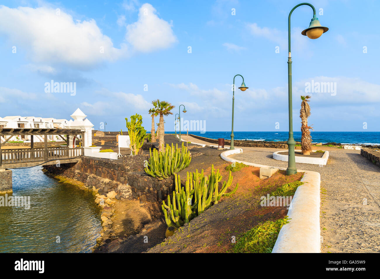 Coastal promenade along ocean in Costa Teguise seaside resort town, Lanzarote, Canary Islands, Spain Stock Photo