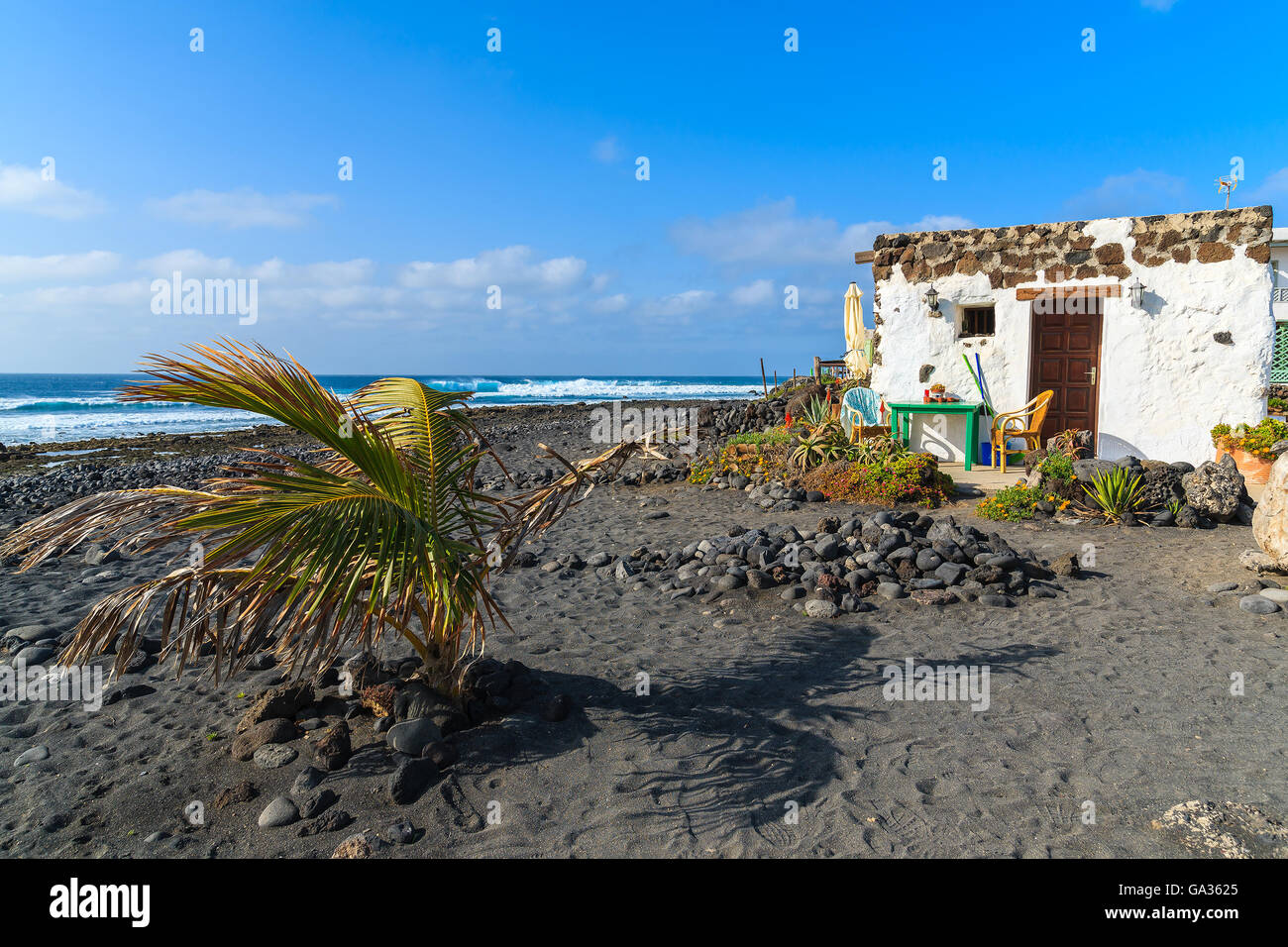 Typical Canarian house for tourists on El Golfo beach, Lanzarote island, Spain Stock Photo