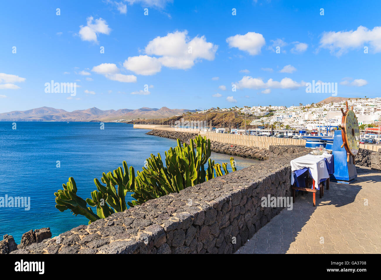 View of coast from promenade on Lanzarote island in Puerto del Carmen town, Spain Stock Photo