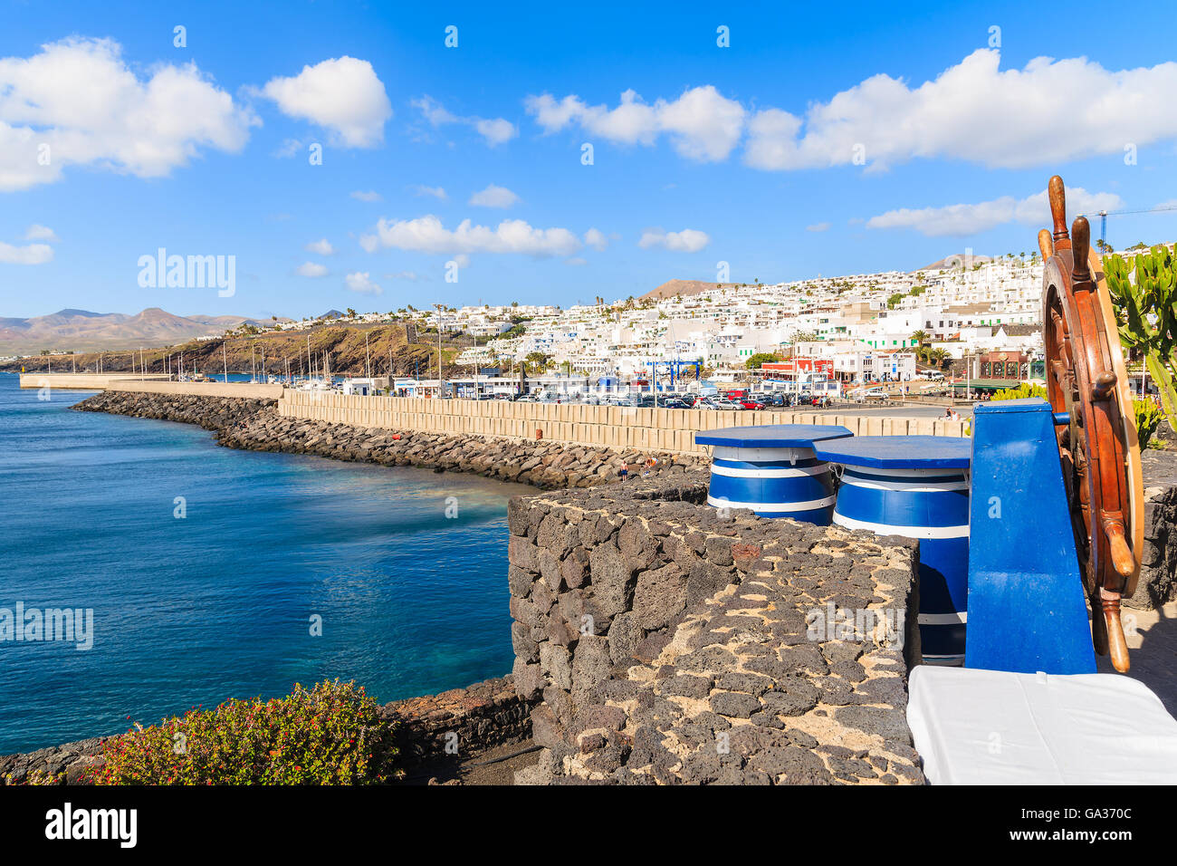 Wine barrels of local restaurant on coast of Lanzarote island in Puerto del Carmen town, Spain Stock Photo