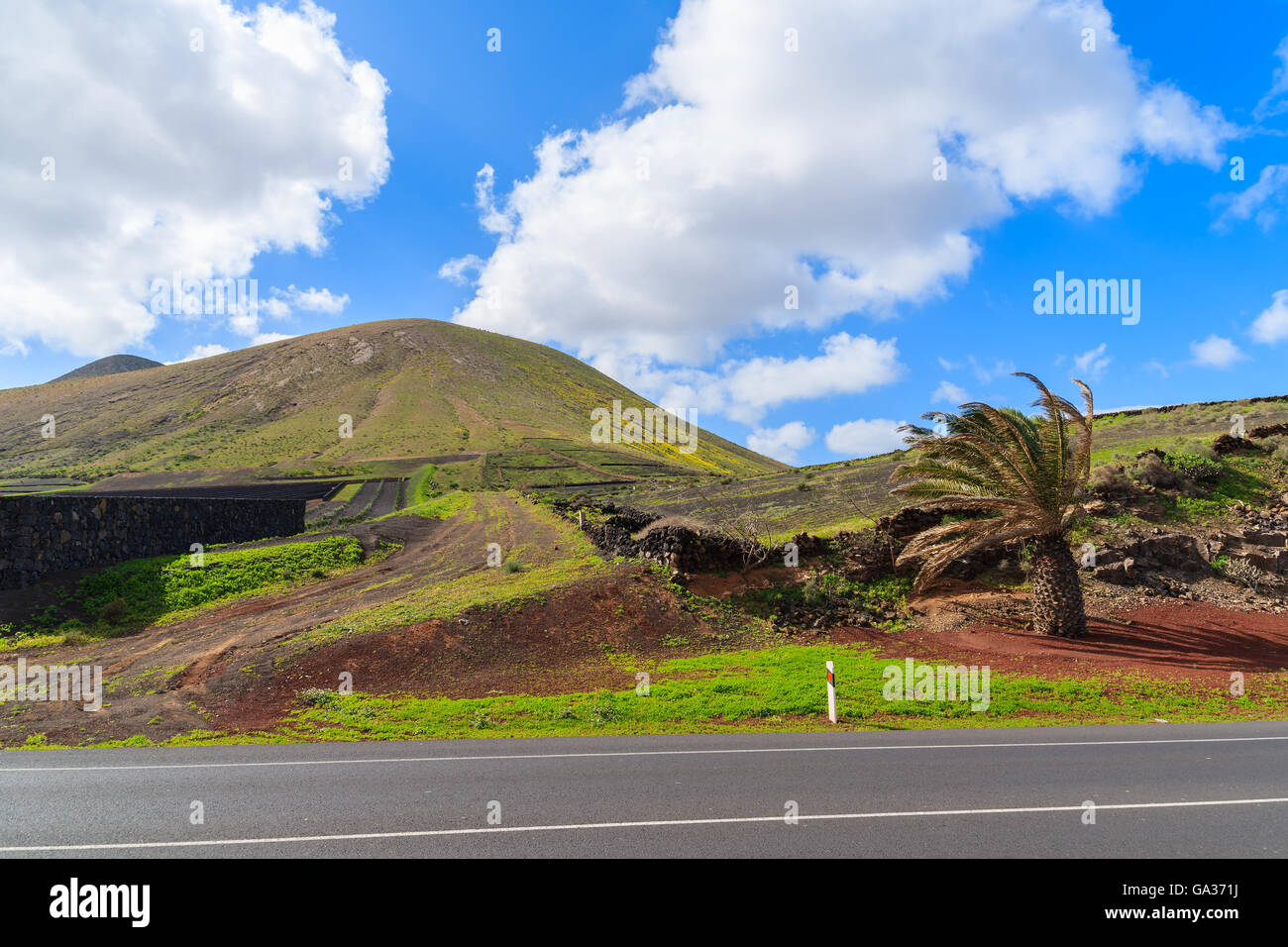 Road in mountain landscape of Lanzarote island near Yaiza, Canary Islands, Spain Stock Photo