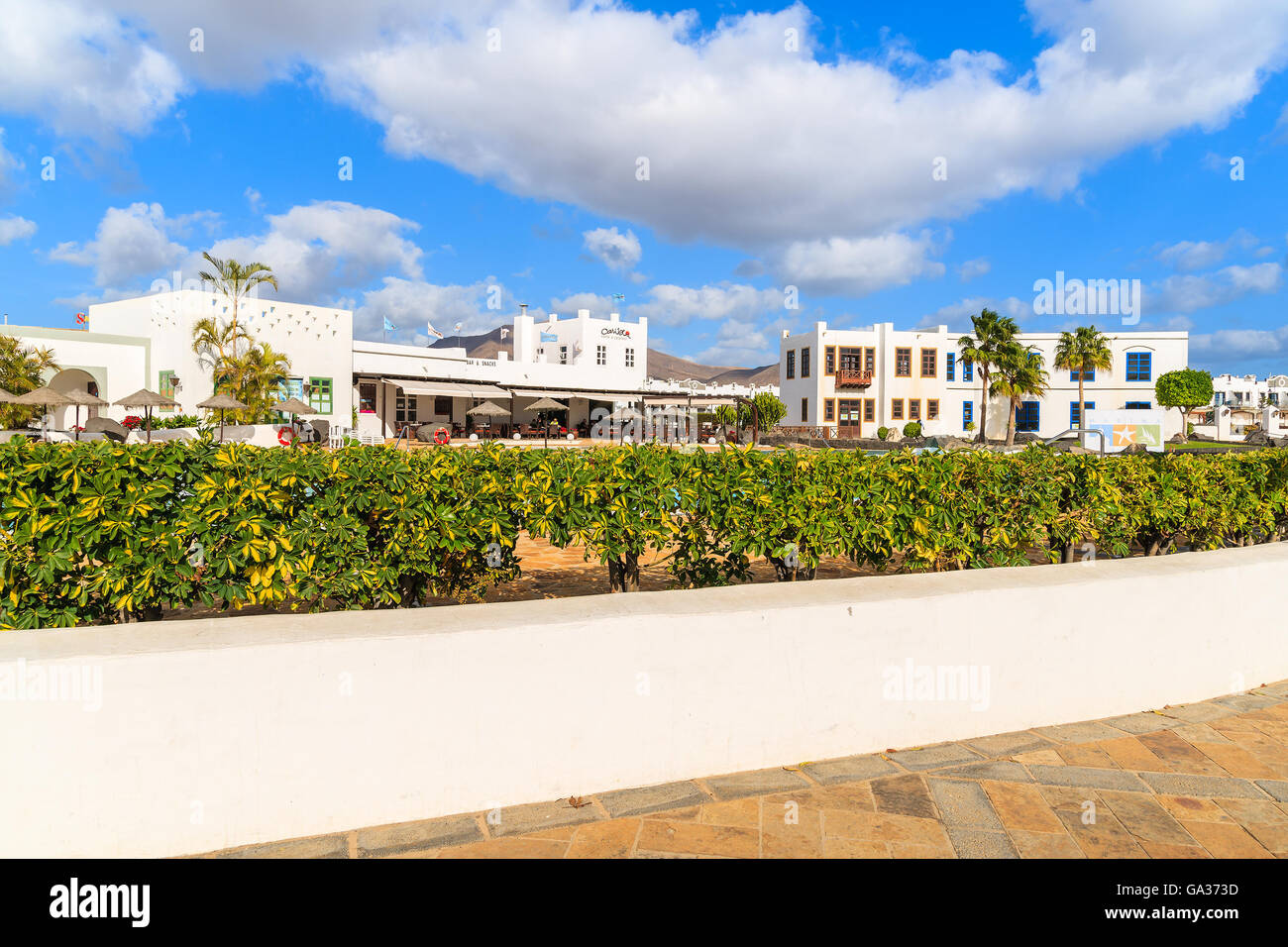PLAYA BLANCA, LANZAROTE ISLAND - JAN 17, 2015: luxury apartment complex built in traditional Canary style on Lanzarote island. Canary Islands are popular holiday destination. Stock Photo