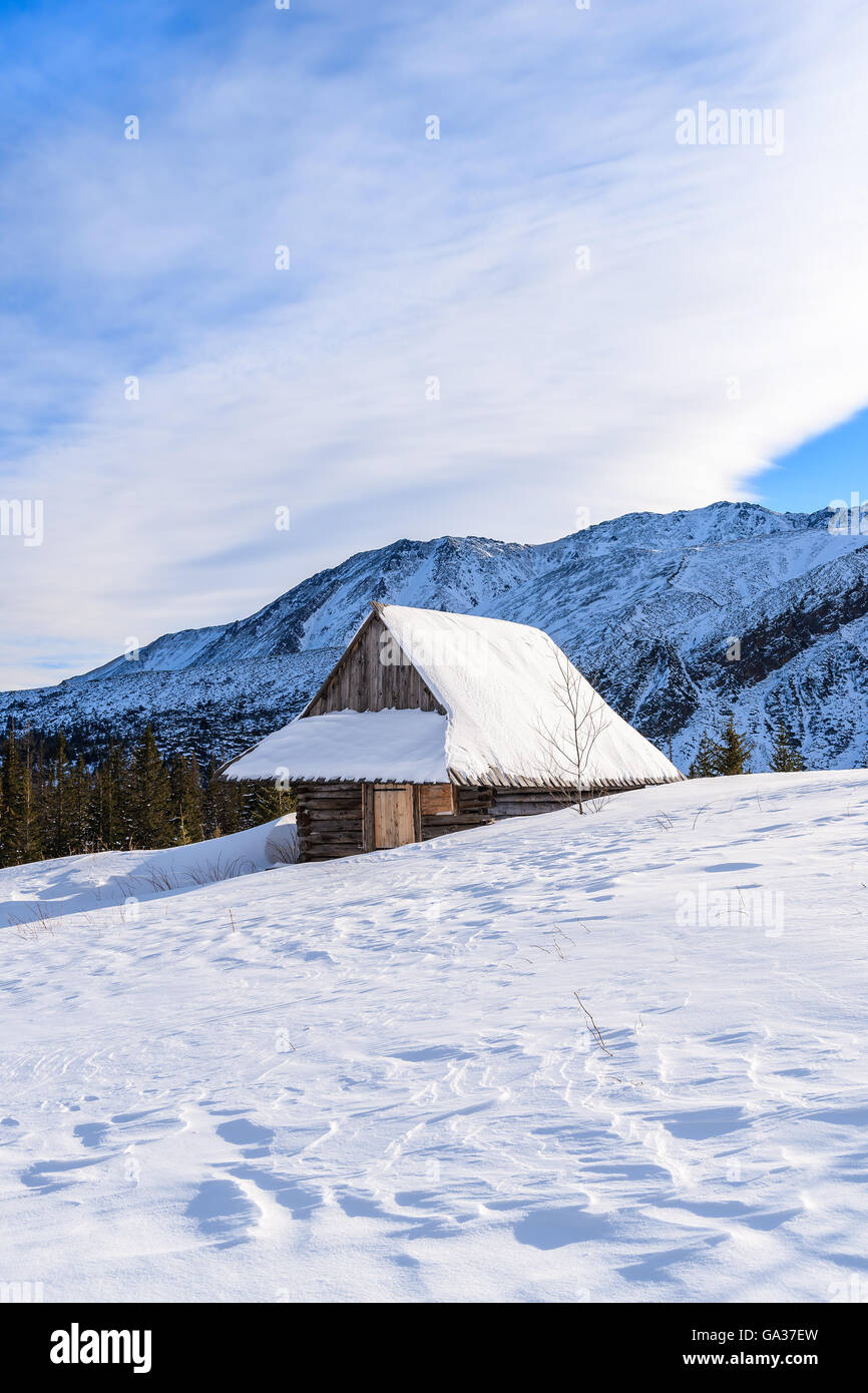 Wooden mountain hut in winter landscape of Gasienicowa valley, Tatra Mountains, Poland Stock Photo