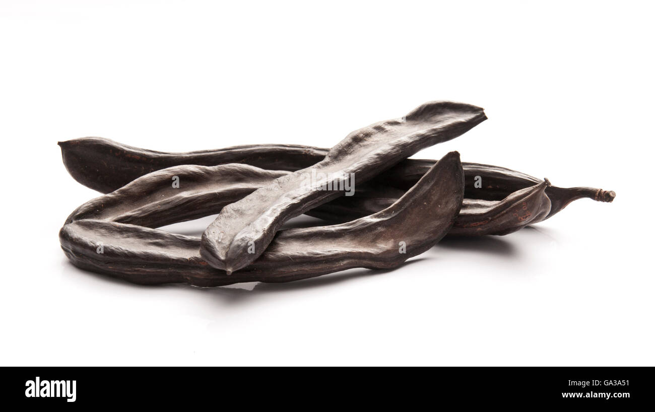 Group of Carob Pods Isolated on White Stock Photo Alamy