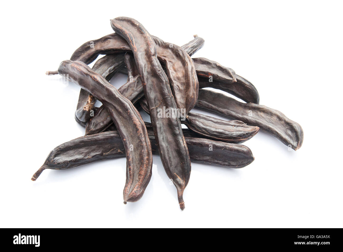 Group of Carob Pods Isolated on White Stock Photo
