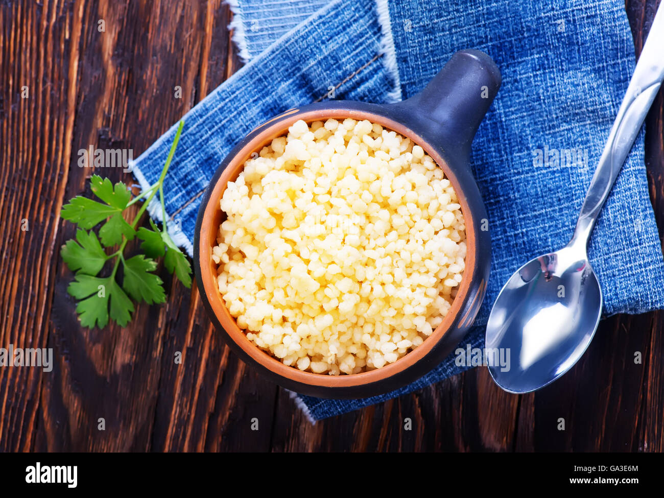 couscous in black bowl and on a table Stock Photo Alamy