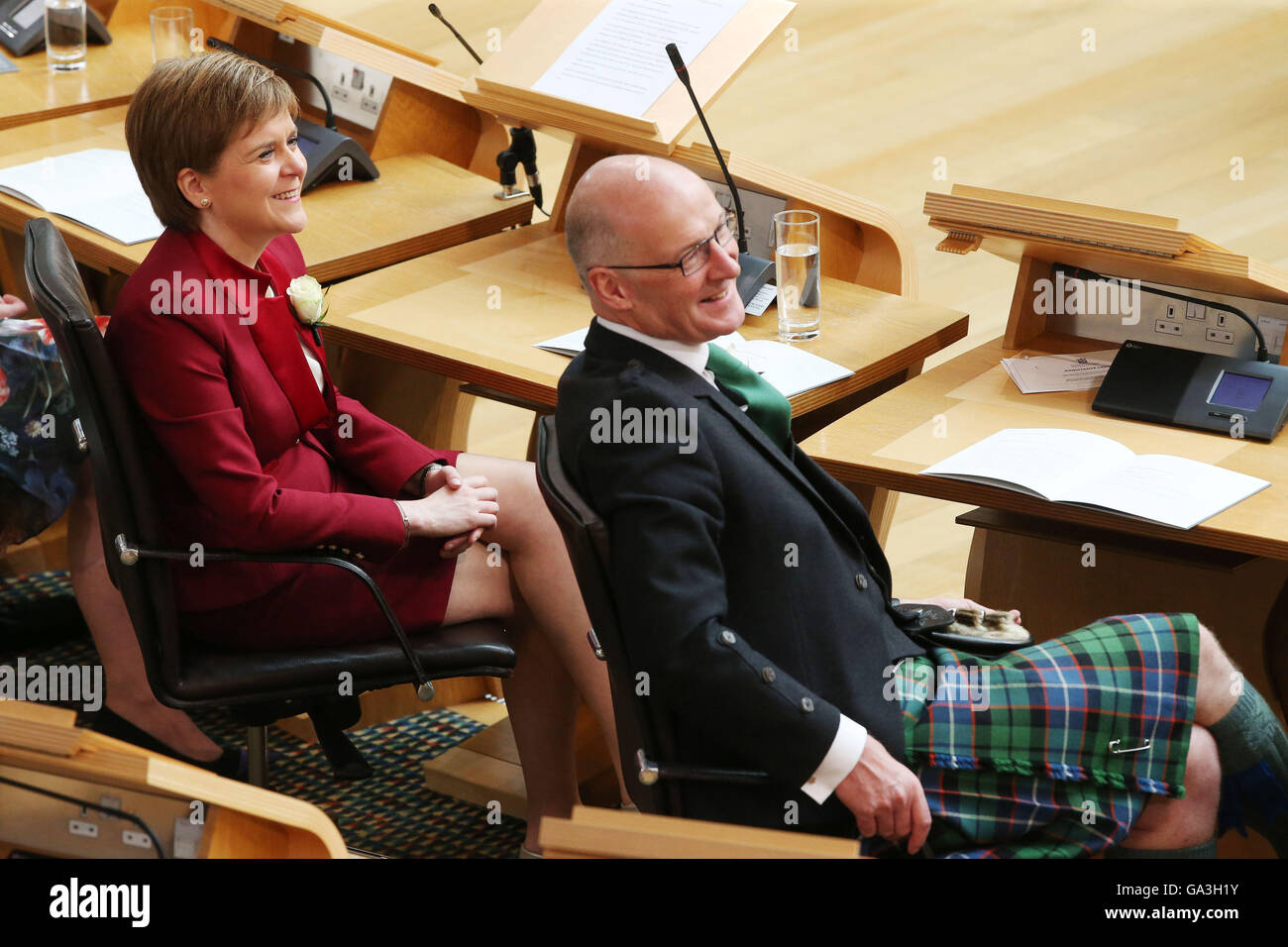 First Minister and SNP leader Nicola Sturgeon and Scottish Green Party co-convener Patrick Harvie during the opening of the fifth session of the Scottish Parliament in Edinburgh. Stock Photo