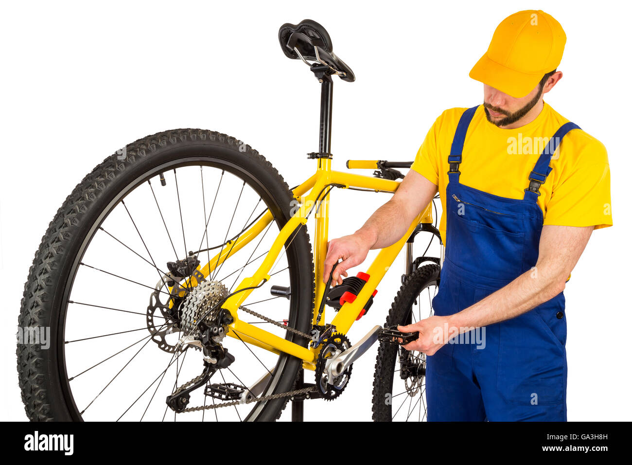 bicycle mechanic adjusting front derailleur mechanism on mountain bike Stock Photo