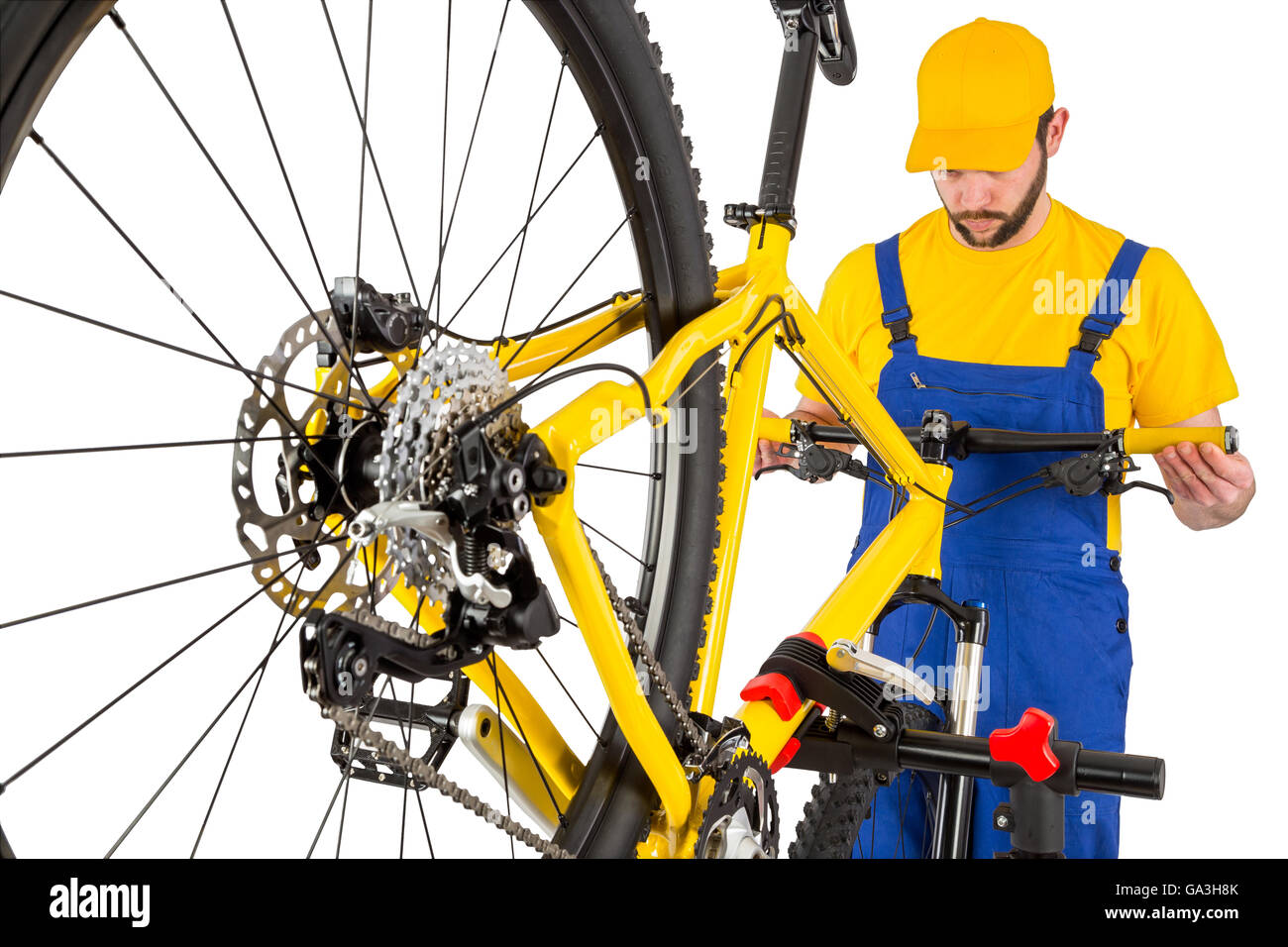 bicycle mechanic straightening handlebar on mountain bike Stock Photo