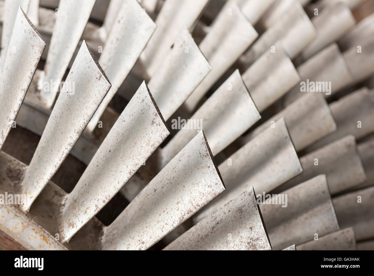 Industrial metal turbine blades in an old factory Stock Photo