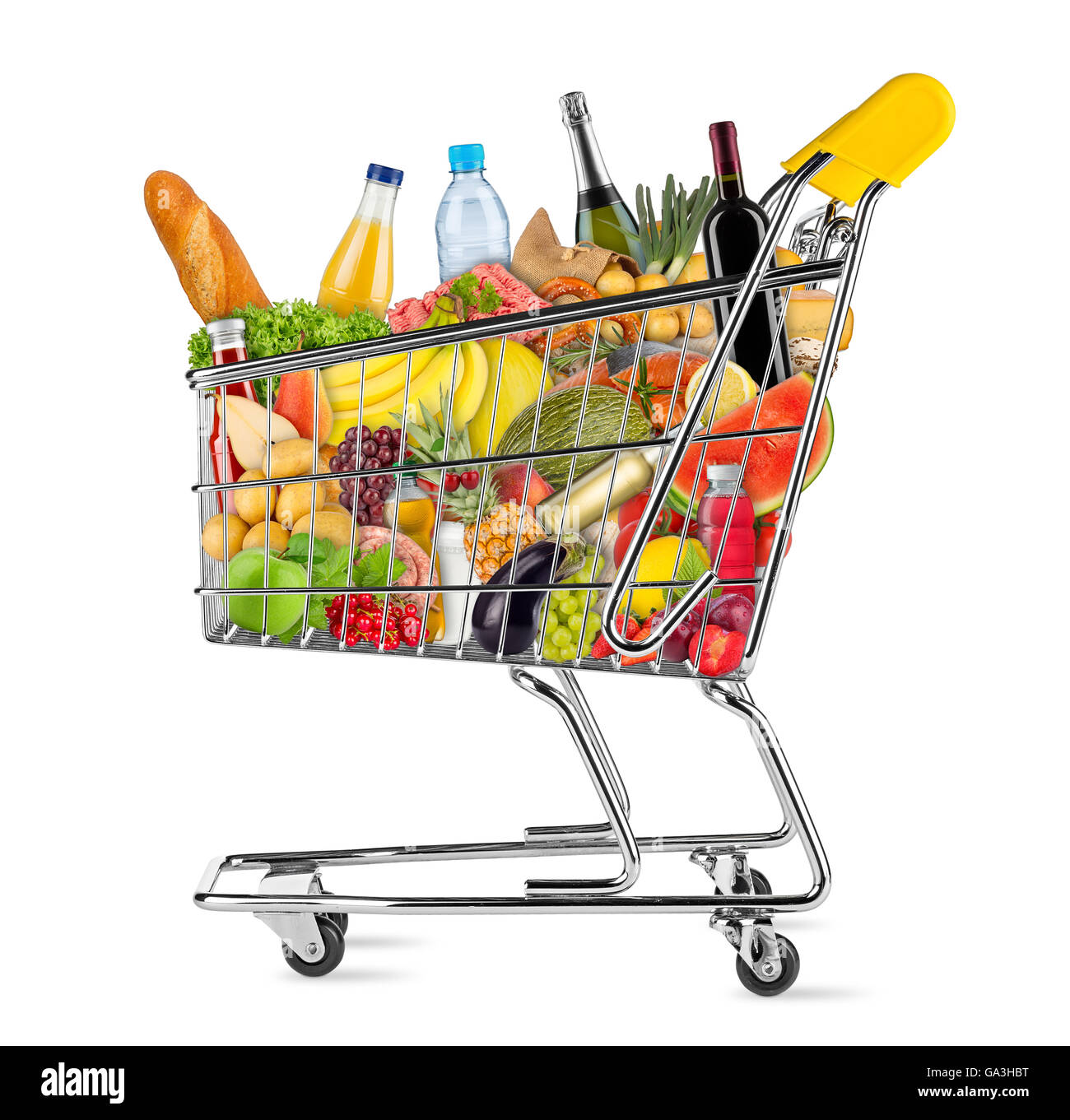 yellow shopping cart filled with various food and beverages isolated on white background Stock Photo