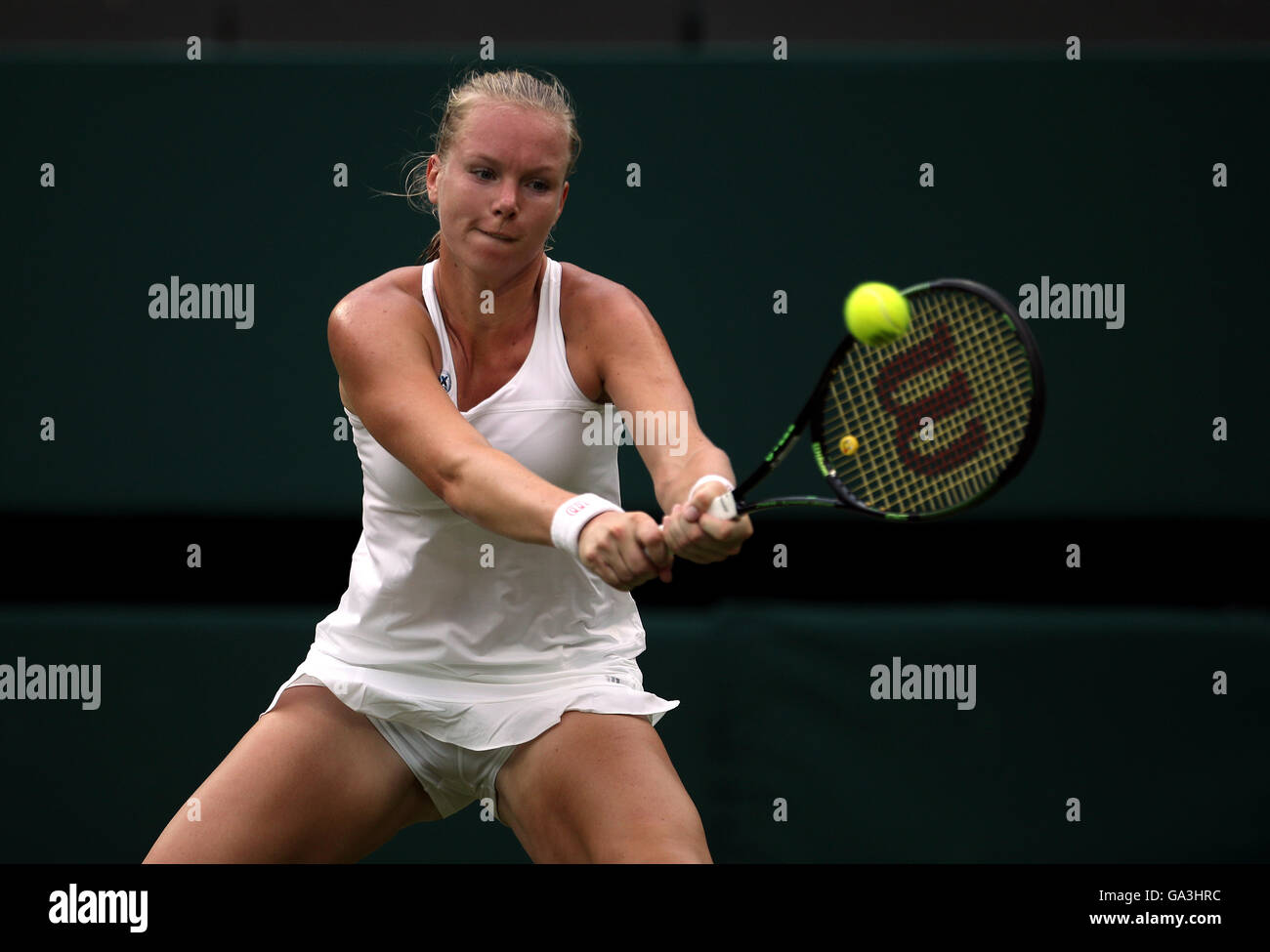 Kiki Bertens in action against Simona Halep on day Six of the Wimbledon  Championships at the All England Lawn Tennis and Croquet Club, Wimbledon  Stock Photo - Alamy