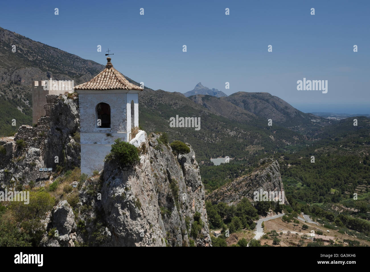 View of Castell d'Alcozaiba and the bell tower, from the top of San Jose Castle, Guadalest, Alicante, Spain, Europe Stock Photo