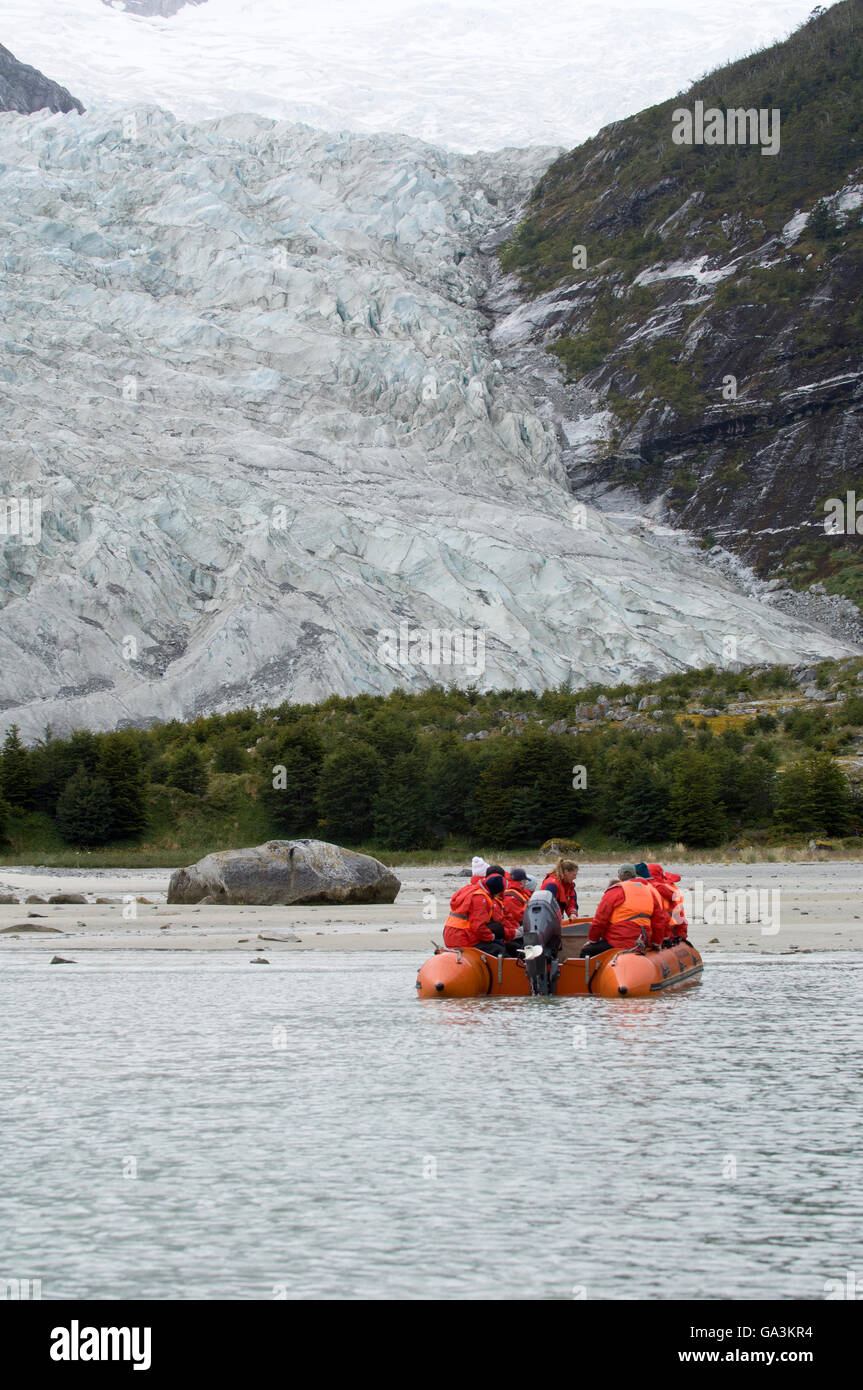 Tourists on a boat, Pia Glacier, Beagle Channel, Darwin National Park, Tierra del Fuego, Patagonia, Chile, South America Stock Photo