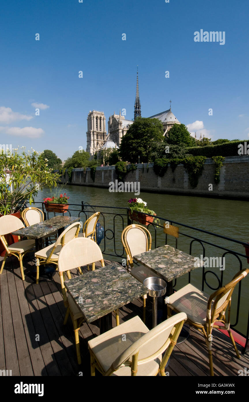 Café on a barge on River Seine in front of Notre Dame Cathedral, Paris, France, Europe Stock Photo
