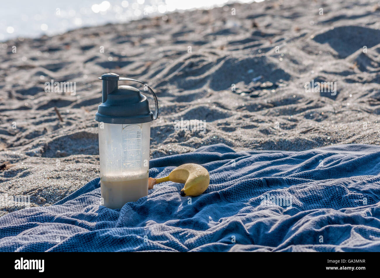 Post workout meal on the beach with whey protein and a banana Stock Photo Alamy