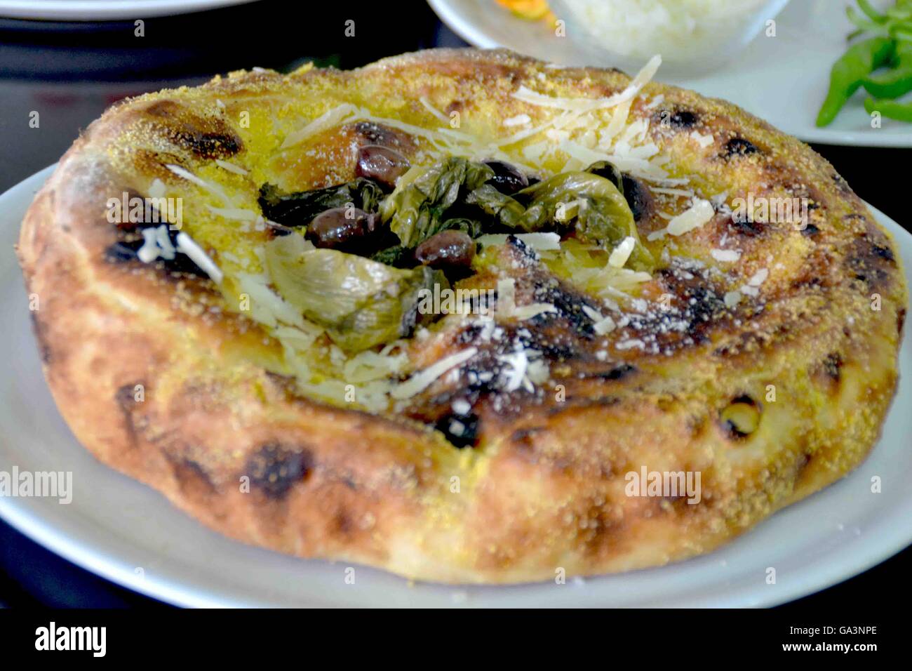 Torre Del Greco, Italy. 02nd July, 2016. This is a stuffed pizza with escarole, pine nuts and olives. Pizza is one of the most famous Italian dishes. It finds its best expression in Naples. © Maria Consiglia Izzo/Pacific Press/Alamy Live News Stock Photo