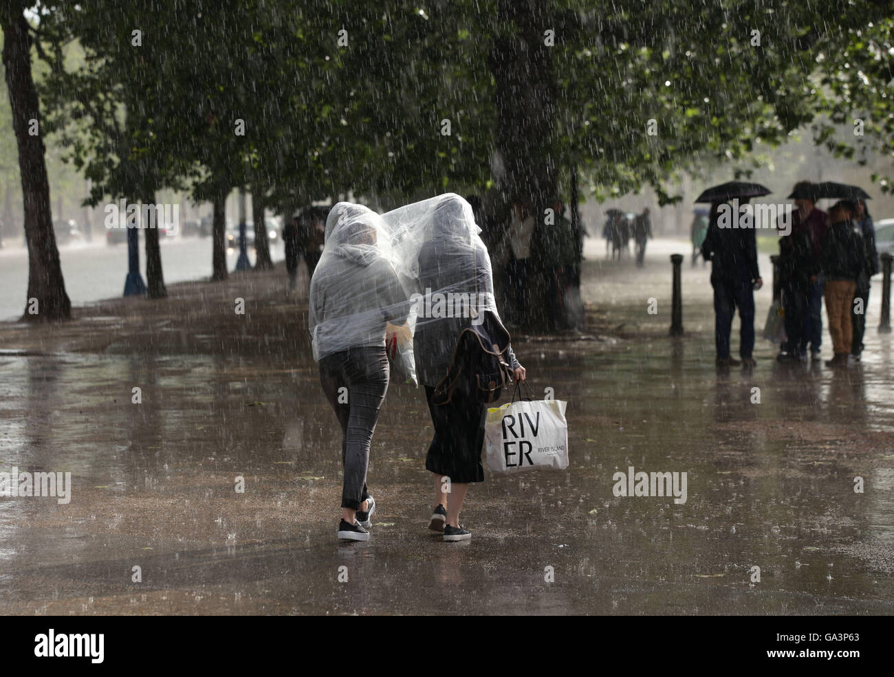 Walk in rain shopping hi-res stock photography and images - Alamy