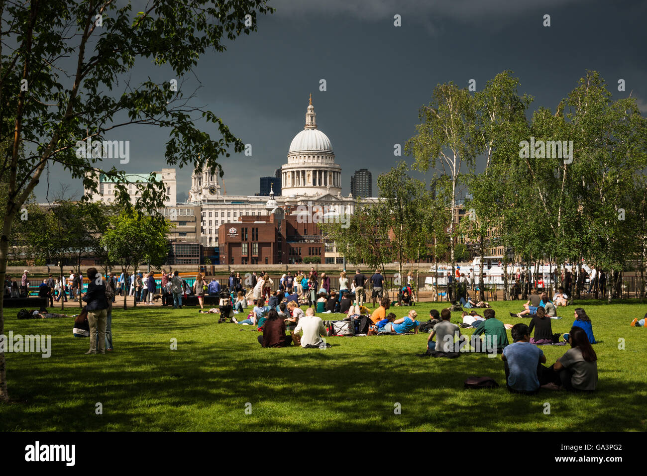 London, United Kingdom - June 25, 2016: St Pauls and a park in front of Tate Modern, moody sky seconds before a storm Stock Photo