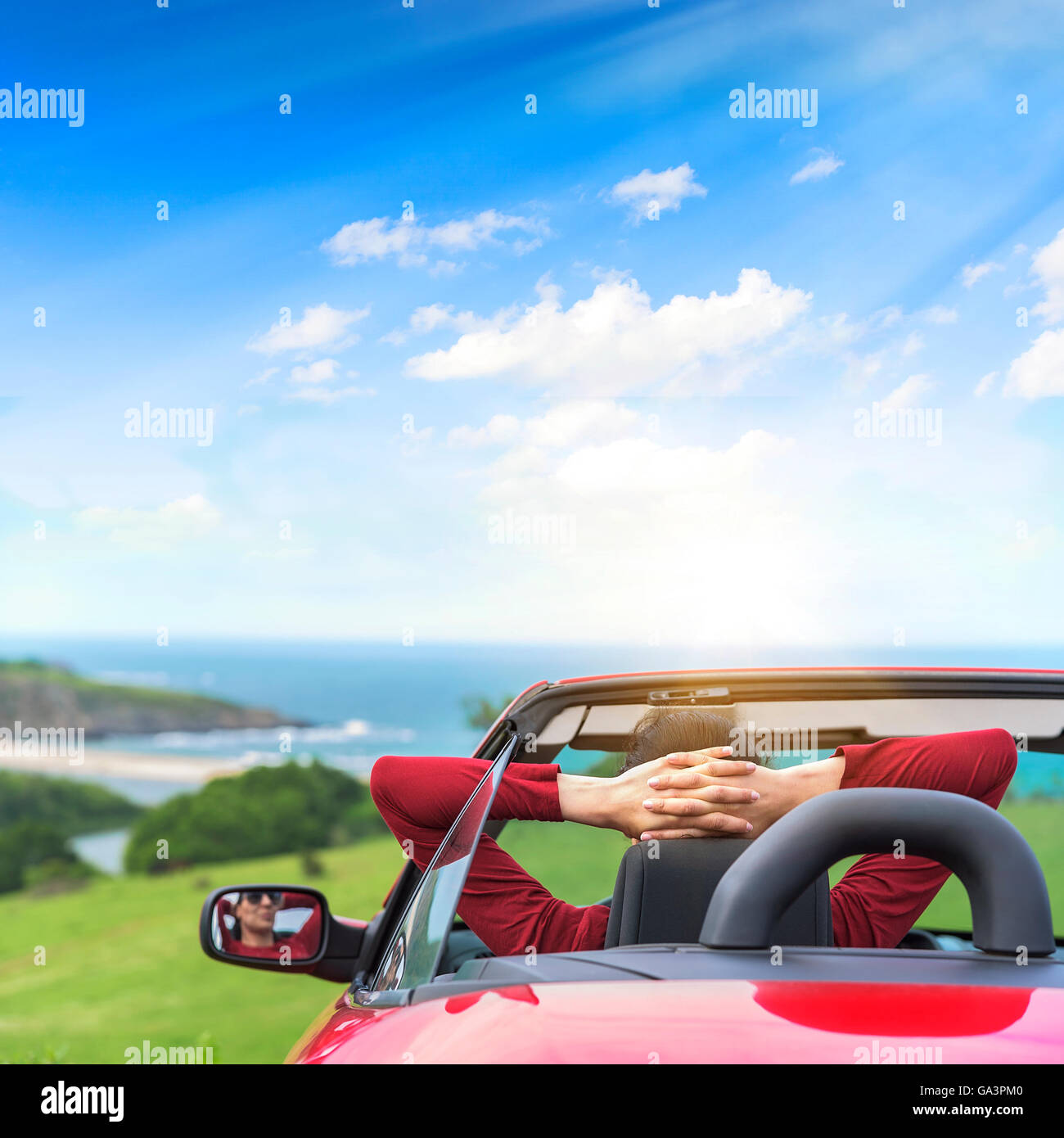 Girl in a red convertible car on a background seascape Stock Photo - Alamy