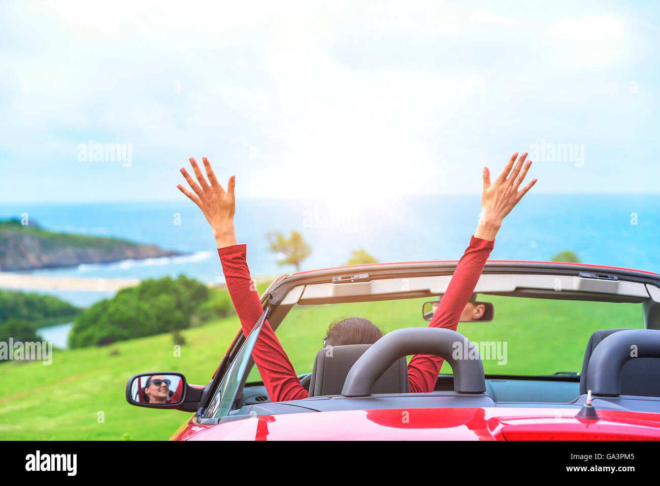 Girl in a red convertible car on a background seascape Stock Photo - Alamy