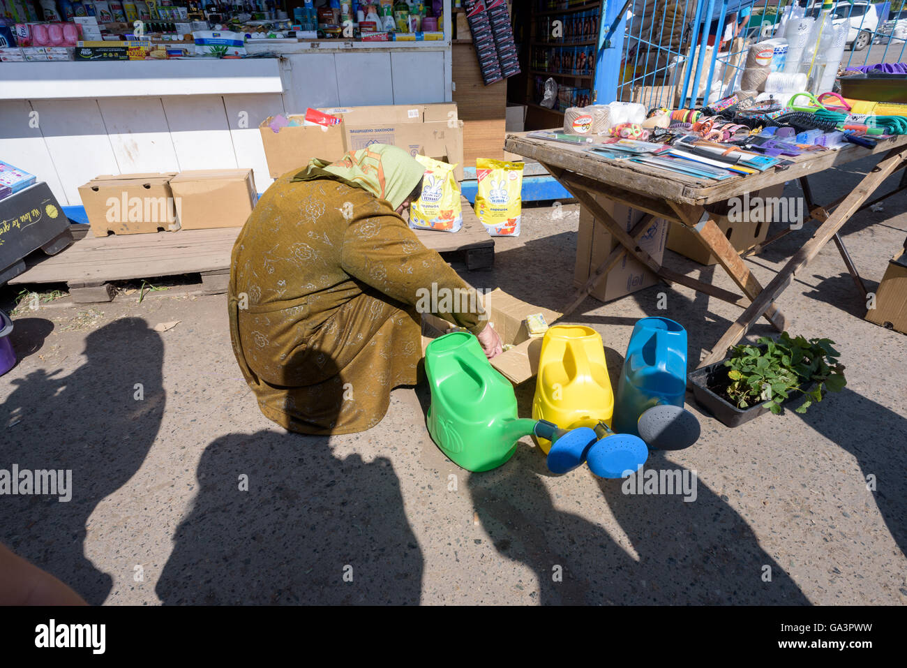 Women looking through bags of soap at a local market in Russia Stock Photo