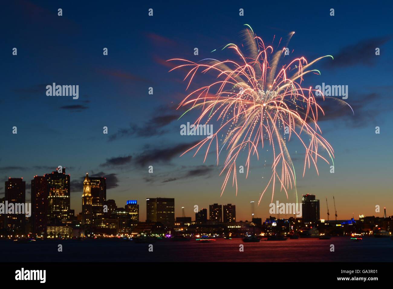 Boston Harborfest Independence Day celebration sunset fireworks show in Boston Harbor. The