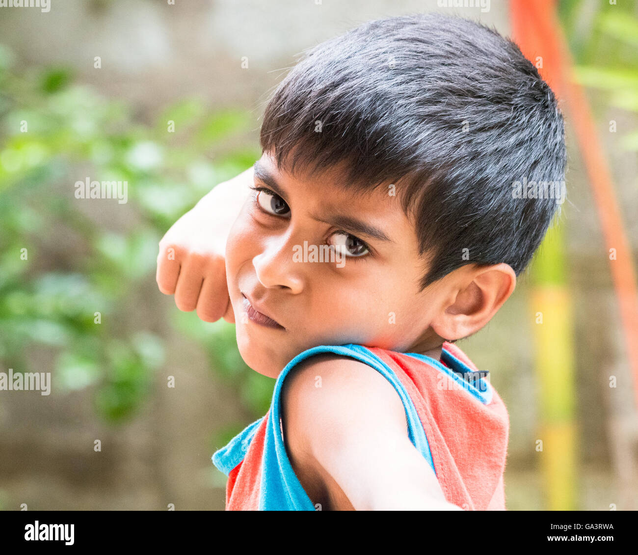 Kid showing emotions of Anger, hate, disgust and distress Stock Photo