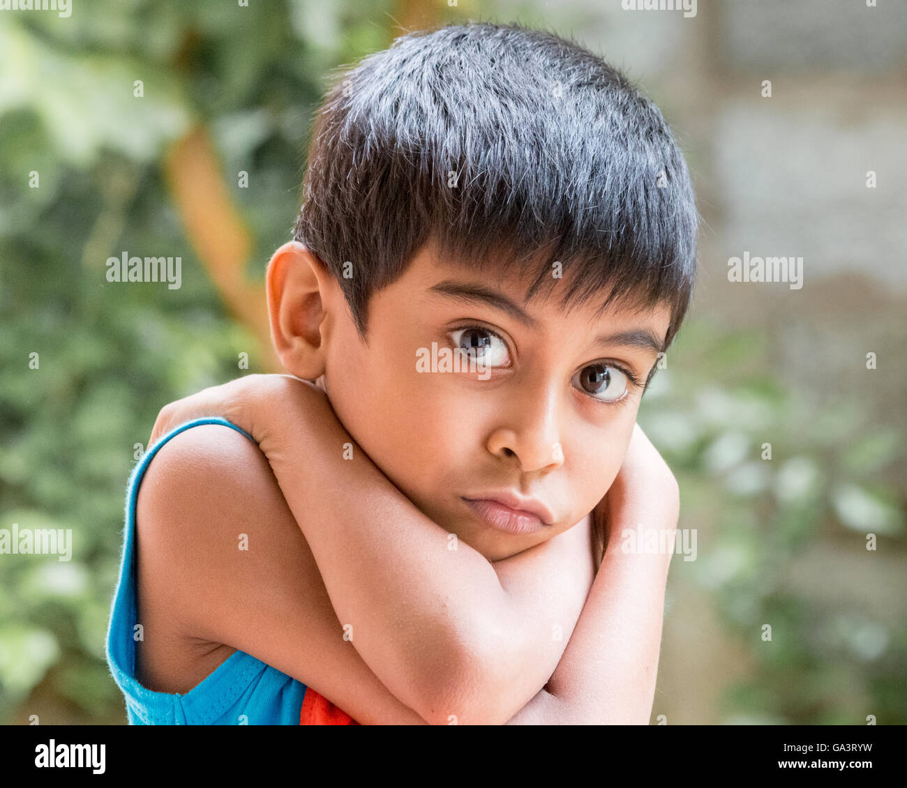 Kid showing emotions of sadness, fear and stress Stock Photo