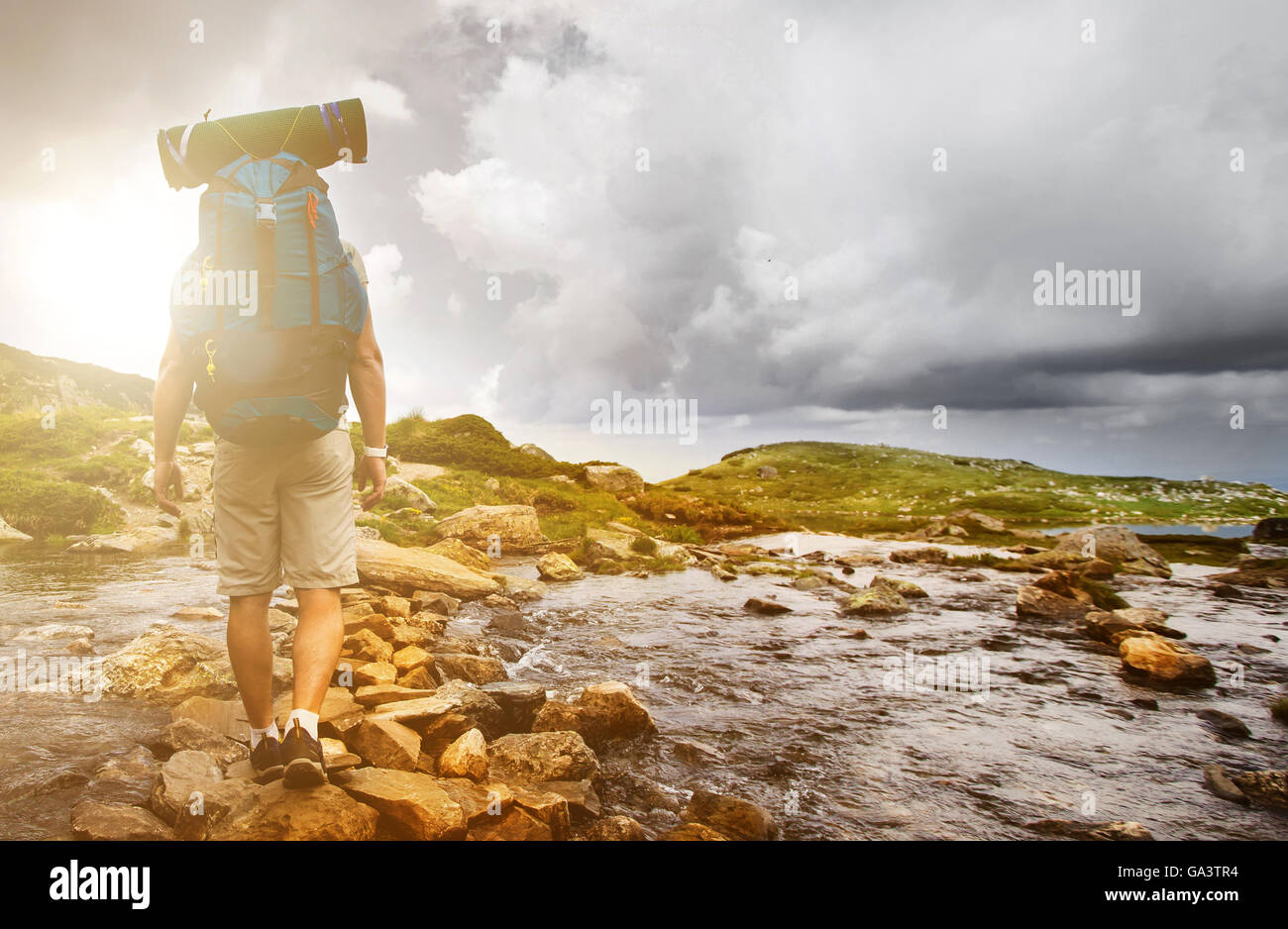 Adult male hiker crossing hi-res stock photography and images - Alamy