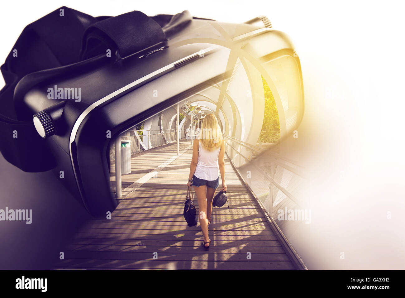 Virtual reality glasses, with three-dimensional image of woman walking towards the inside of the screen, google's conceptual ide Stock Photo