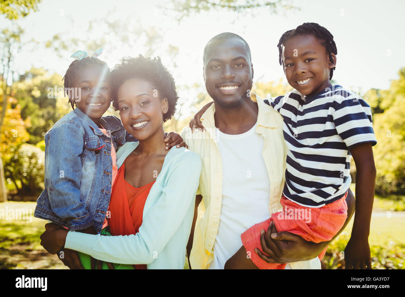 Happy family posing together Stock Photo - Alamy