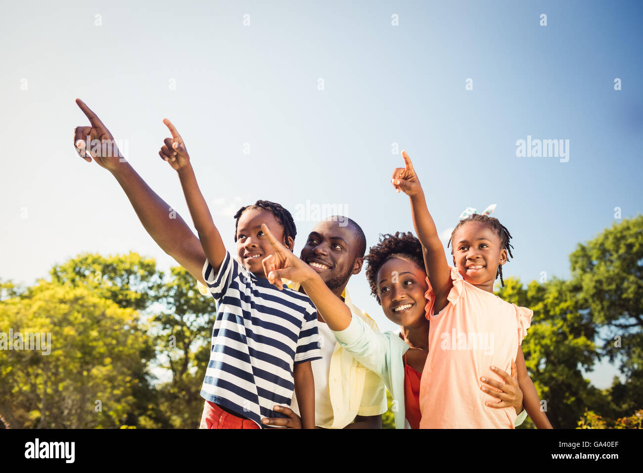 Happy family posing together Stock Photo - Alamy