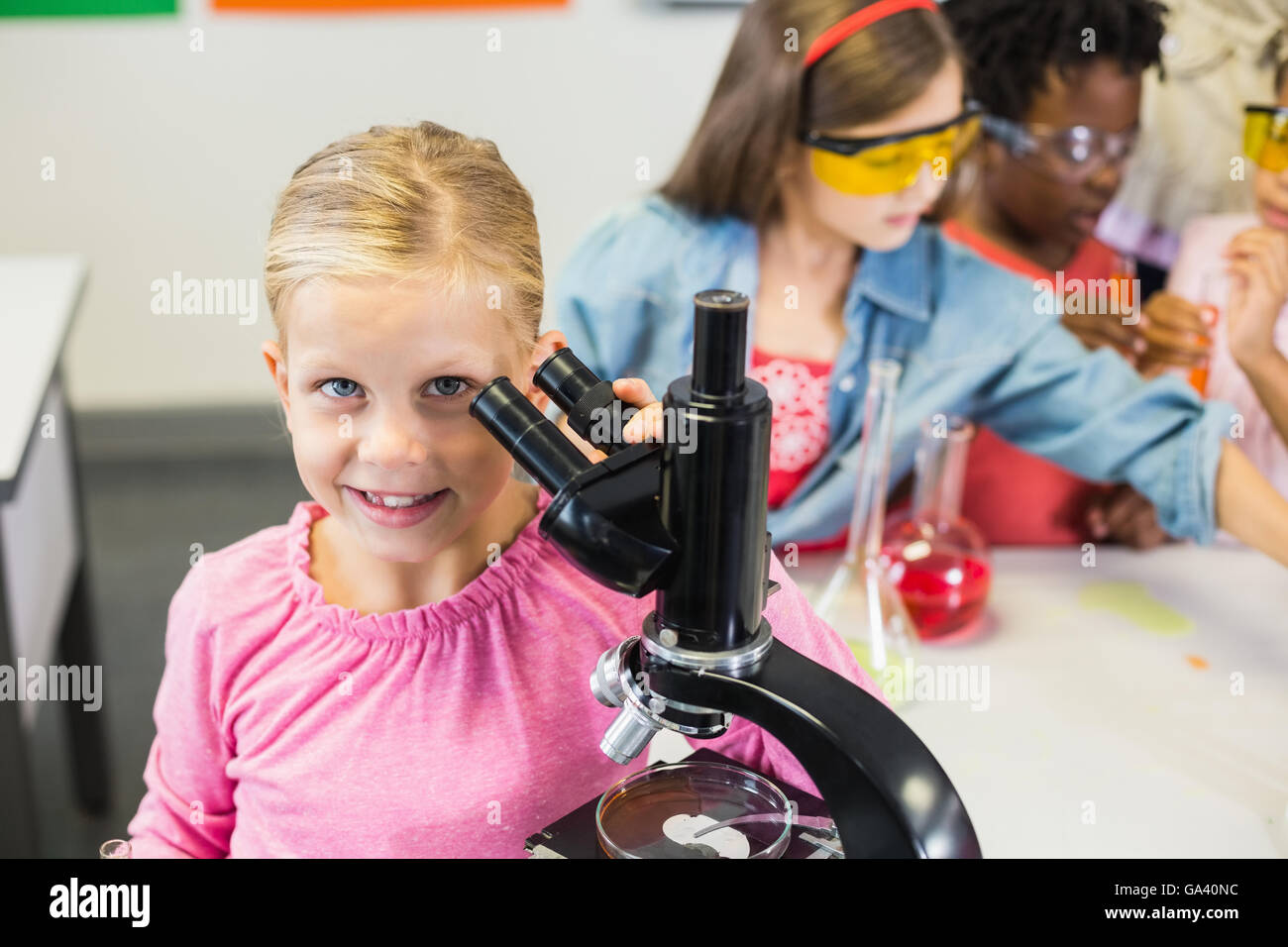 Student girl looking microscope hi-res stock photography and images - Alamy