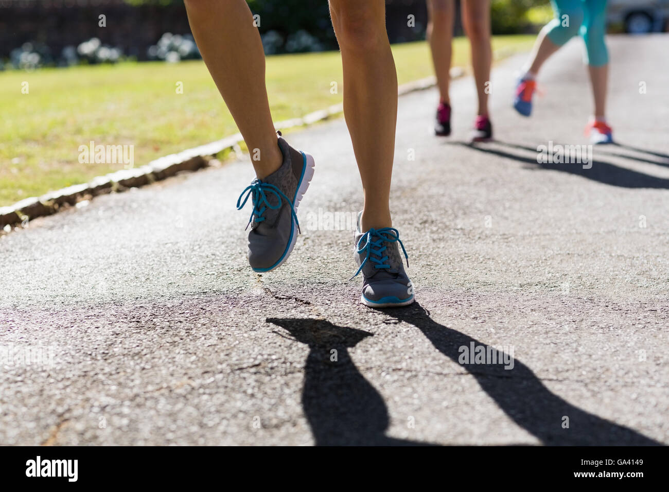 Female athletes feet running on running track Stock Photo Alamy