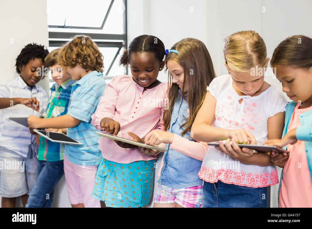 Students using digital tablet in classroom Stock Photo Alamy