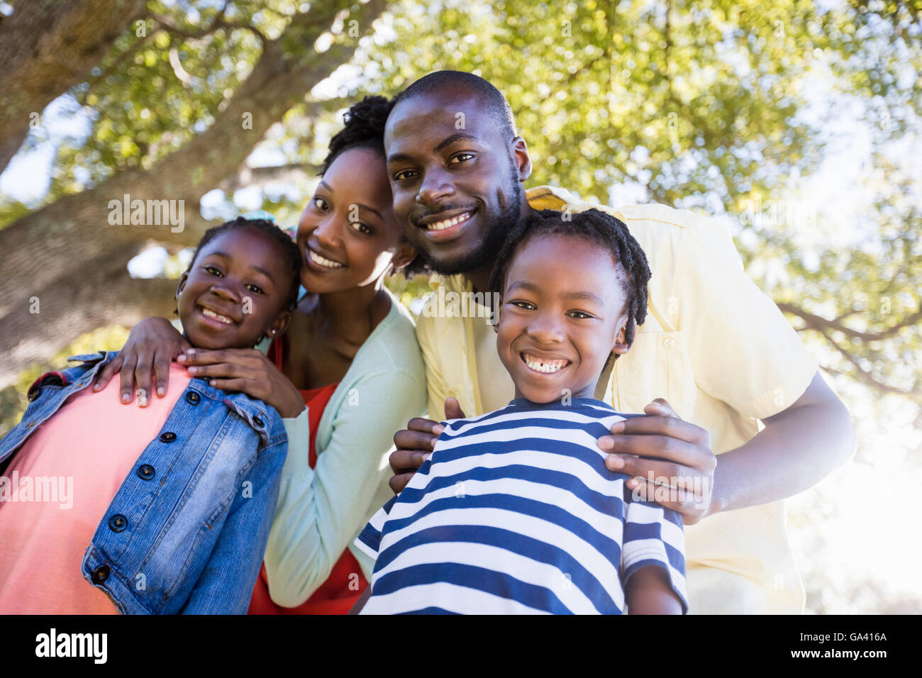 Happy family posing together Stock Photo - Alamy