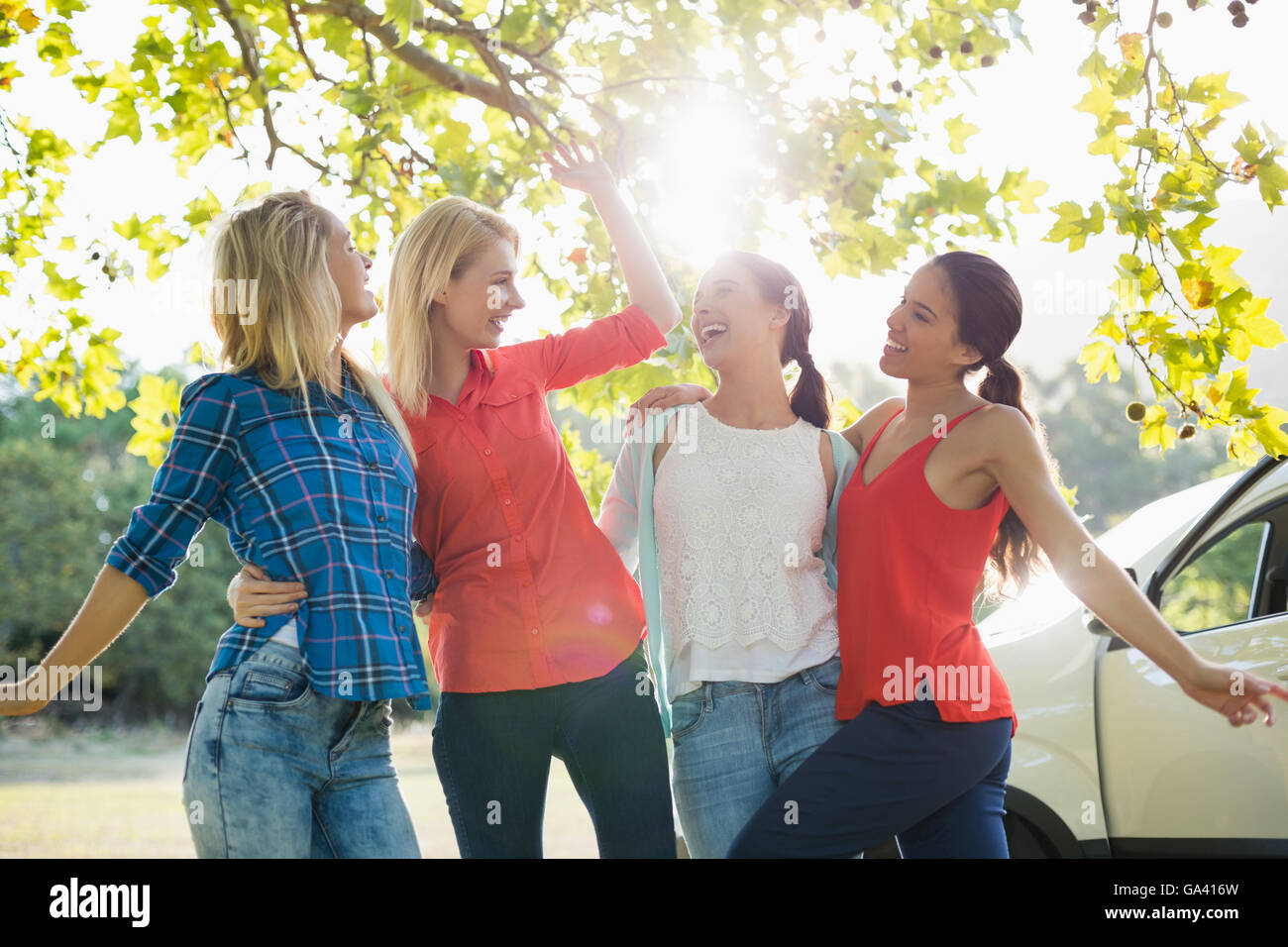 Group of friends having fun in park Stock Photo - Alamy