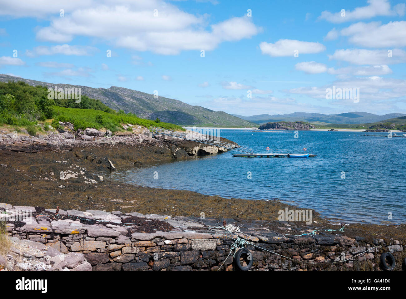 Looking across the Loch to the mainland from Isle Martin, Loch Kanaird, Highlands, Scotland, UK. Stock Photo