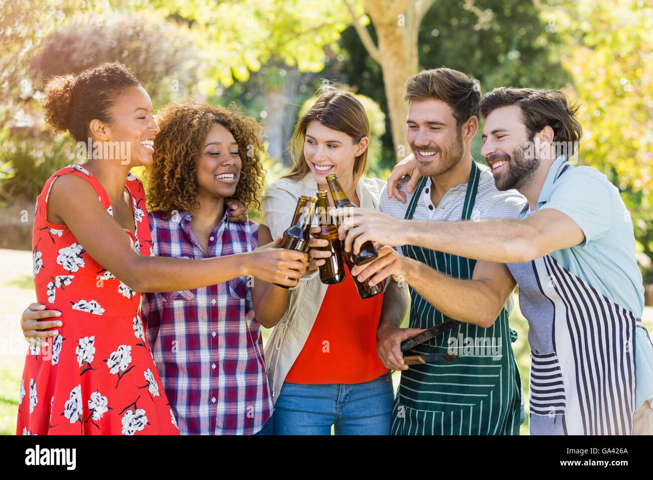 Couple having beer on a pickup truck bonnet Stock Photo - Alamy