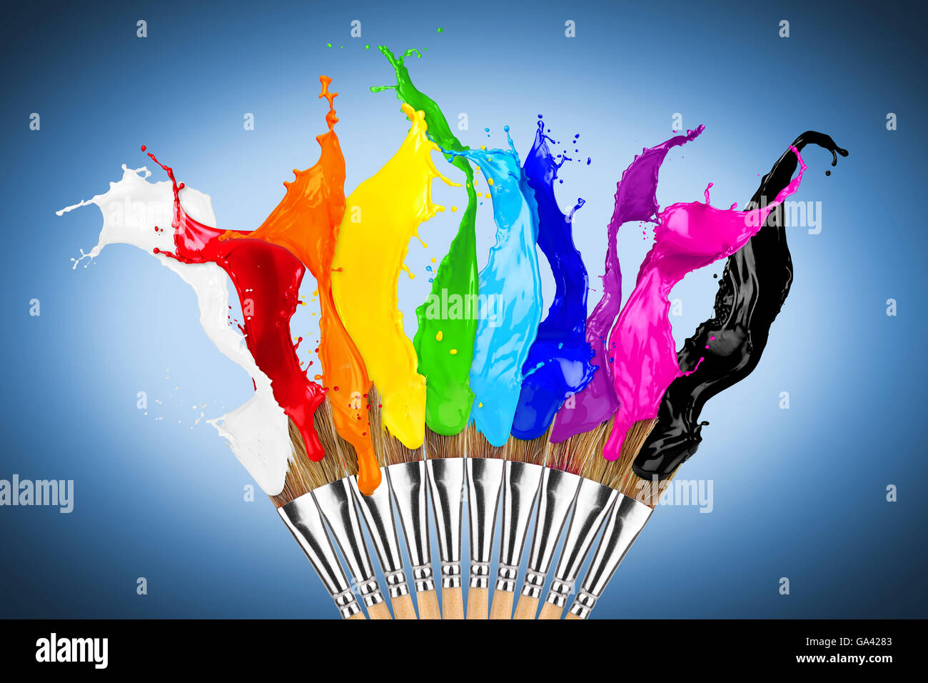 colorful color splashes paintbrush row isolated on blue background Stock Photo