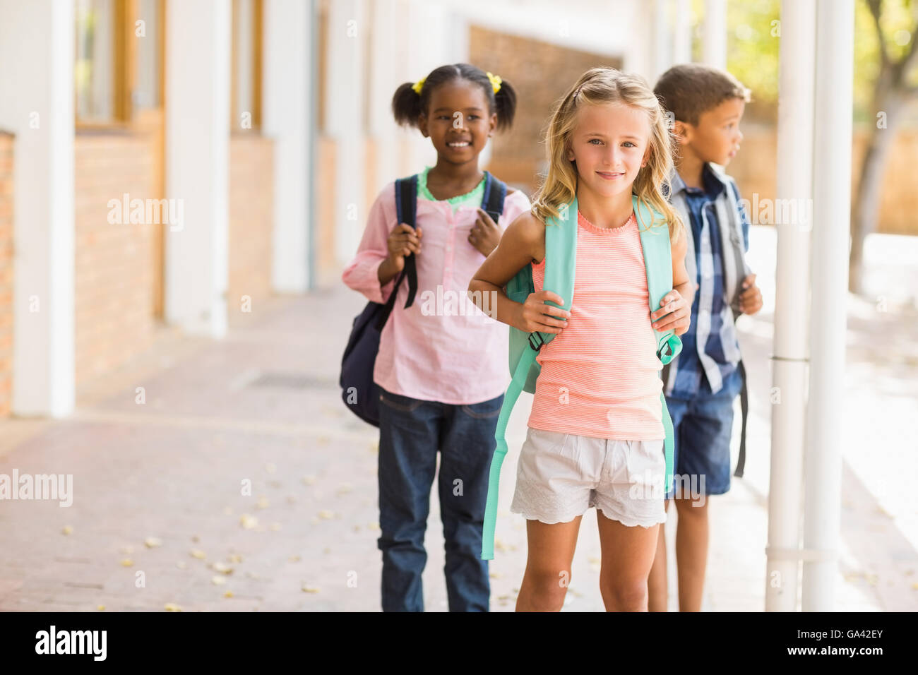 School kids standing in school corridor Stock Photo - Alamy