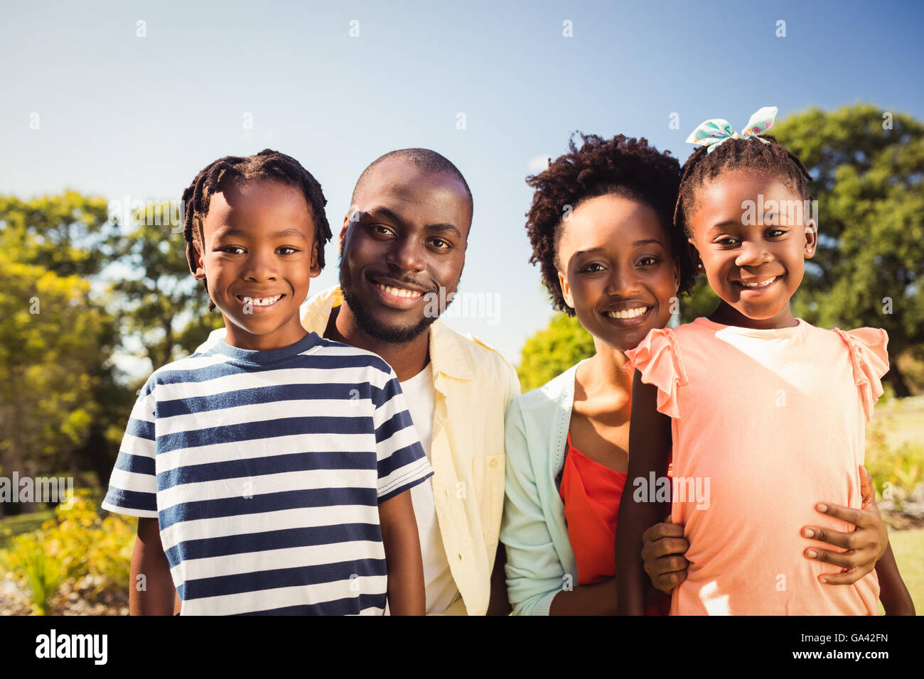 Happy family posing together Stock Photo - Alamy